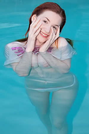 Teen Emily Archer is swimming in the pool