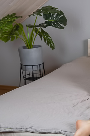 Liby Teases With Flirty Glances Across Her Bed